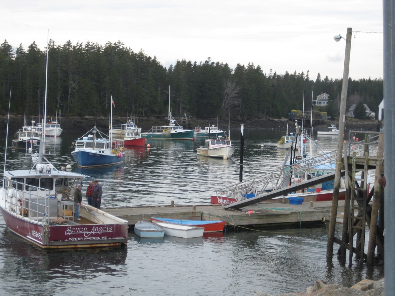 a photo of several boats docked in a harbor